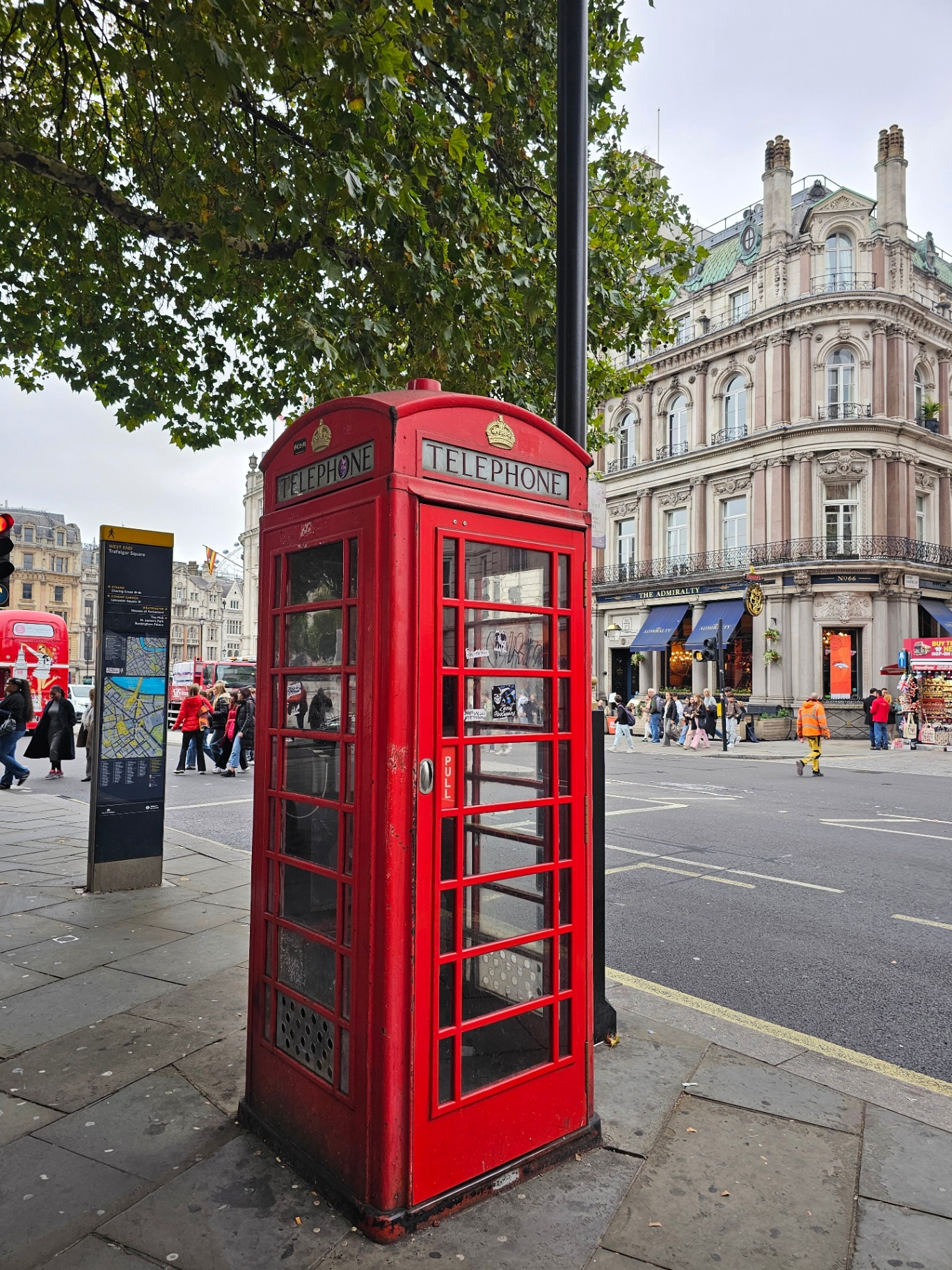 A red telephone box on a London street