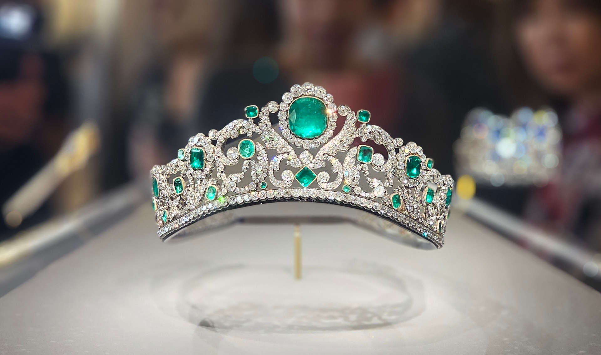 Diamond and emerald tiara displayed in a museum