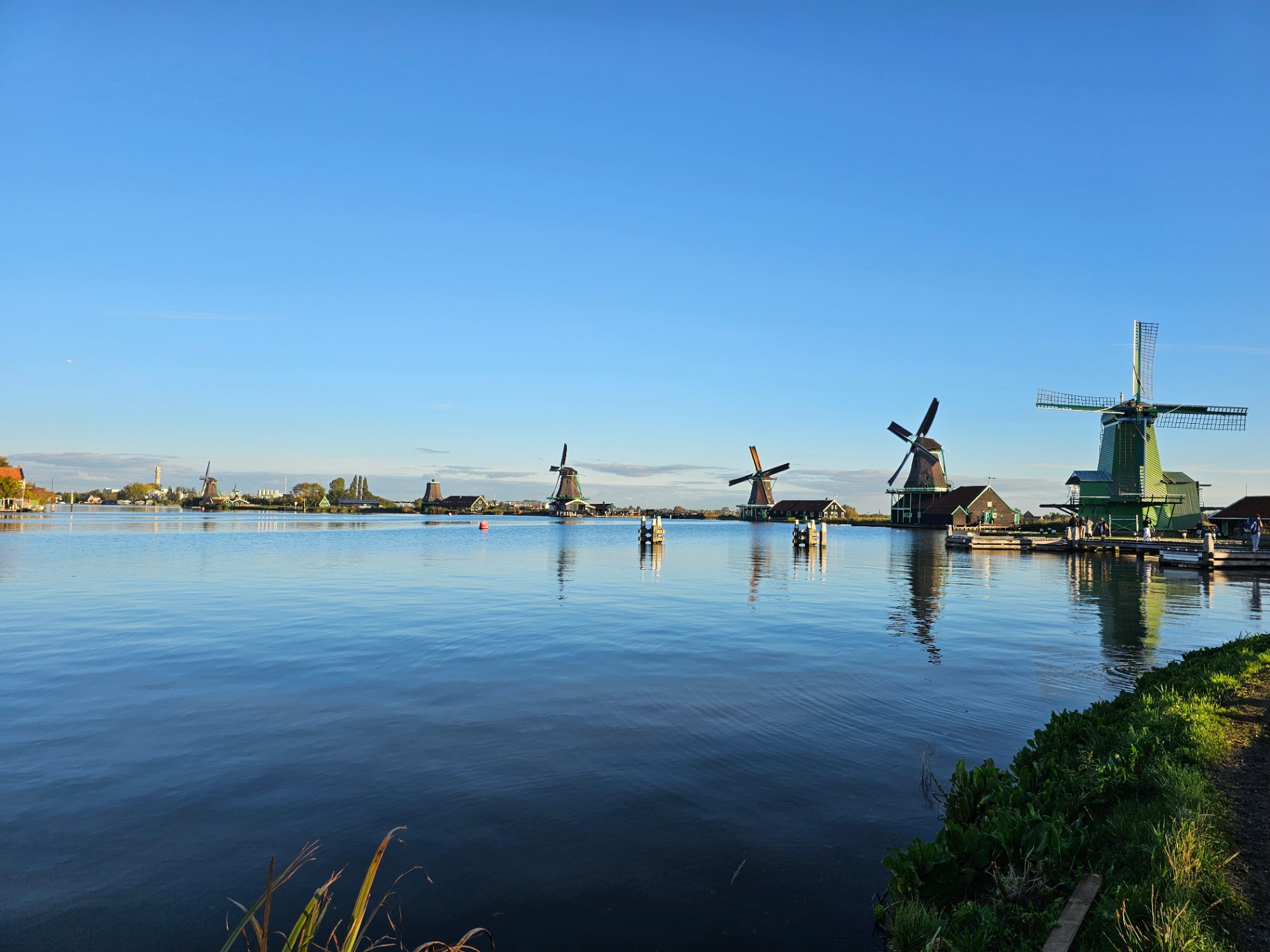 Traditional Dutch windmills beside a canal